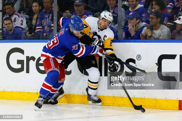 Pittsburgh Penguins center Sidney Crosby battles New York Rangers defenseman Adam Fox during game 1 of the first round of the Stanley Cup Playoffs...