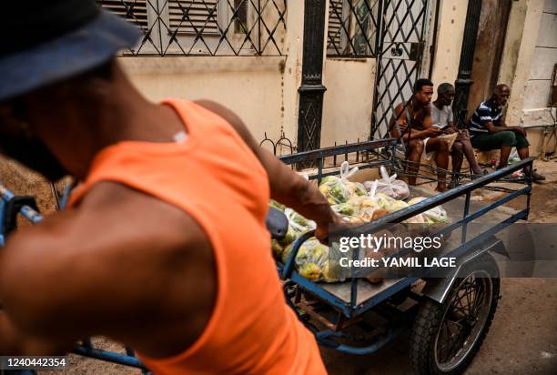 Cuban man sells fruits along a street of Havana, on May 4, 2022.