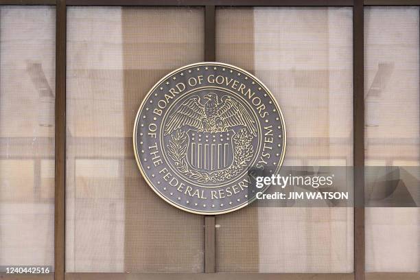 The seal of the Federal Reserve Board of Governors is displayed across from the Marriner S. Eccles Federal Reserve building in Washington, DC, on May...