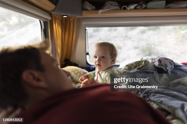 In this photo illustration a toddler is playing in a camper.