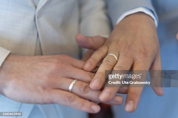In this photo illustration a man i putting on a wedding ring.