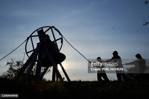 The bell is rung during the commemoration at the former execution site Waalsdorpervlakte in the dunes of Wassenaar, The Netherlands, May 4, 2022. -...