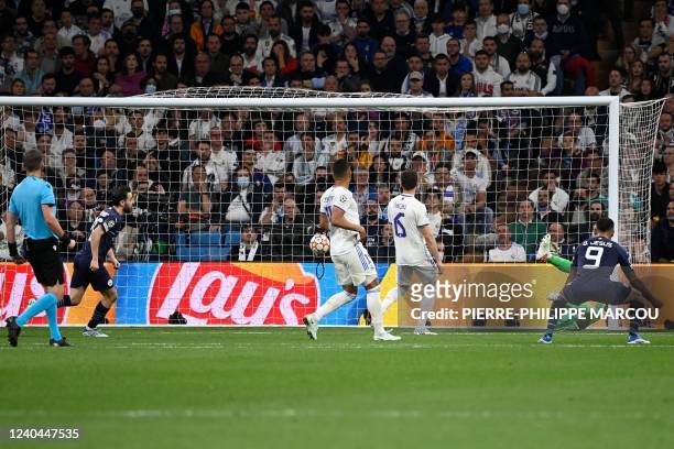 Manchester City's Algerian midfielder Riyad Mahrez scores a goal during the UEFA Champions League semi-final second leg football match between Real...