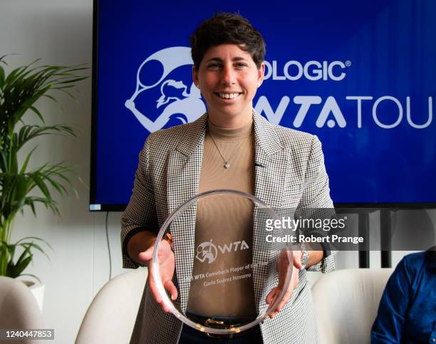 Carla Suarez Navarro of Spain poses with the 2021 WTA Comeback Player of the Year Award on Day 7 of the Mutua Madrid Open at La Caja Magica on May...