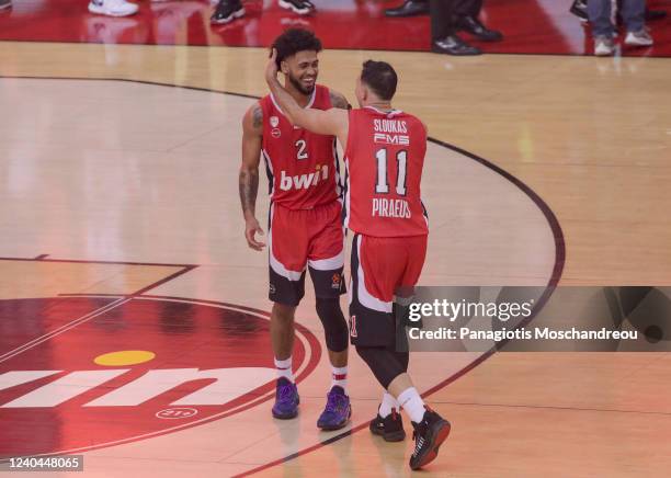 Players of Olympiacos Piraeus celebrate their victory after the final whistle of the Turkish Airlines EuroLeague Play Off Game 5 match between...