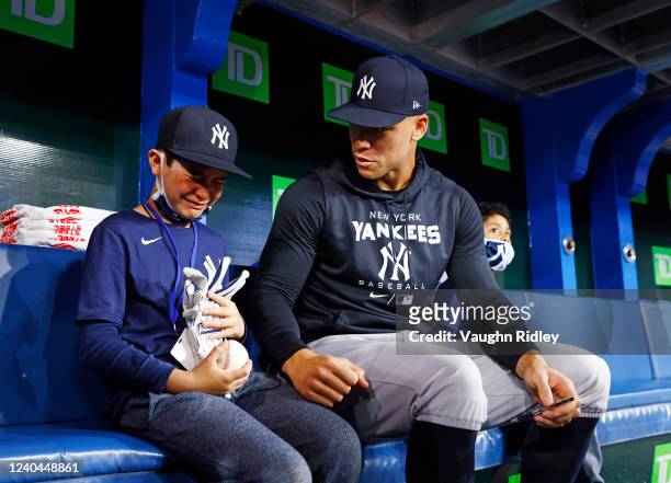 Fan Derek Rodriguez reacts while meeting Aaron Judge of the New York Yankees prior to a MLB game against the Toronto Blue Jays at Rogers Centre on...