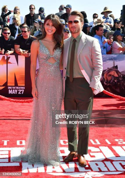 Actor Glen Powell and girlfriend Gigi Paris attend the world premiere of "Top Gun: Maverick!" aboard the USS Midway in San Diego, California on May...