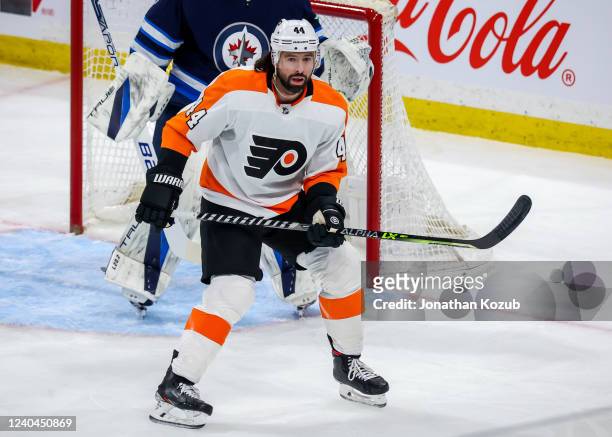 Nate Thompson of the Philadelphia Flyers keeps an eye on the play during first period action against the Winnipeg Jets at Canada Life Centre on April...