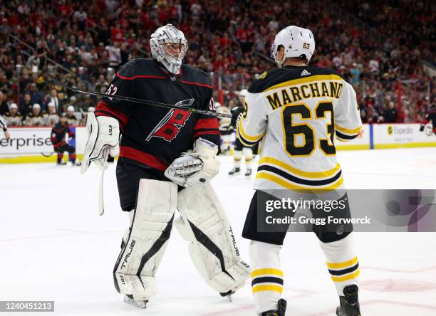 Goaltender Pyotr Kochetkov of the Carolina Hurricanes squares up after a hit in the crease from Brad Marchand of the Boston Bruins in Game Two of the...