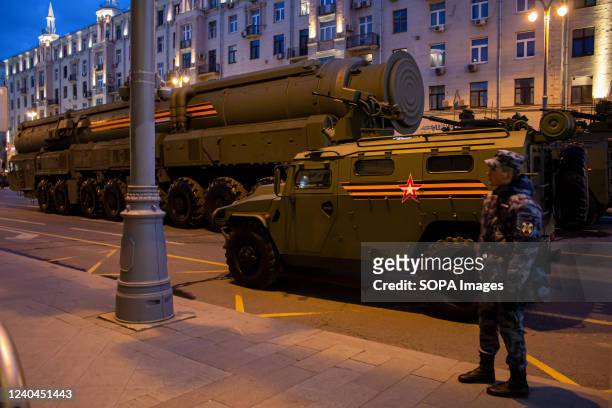 Russian military vehicles and mobile intercontinental ballistic missile launchers are seen on Tverskaya street in Moscow as the military prepare to...