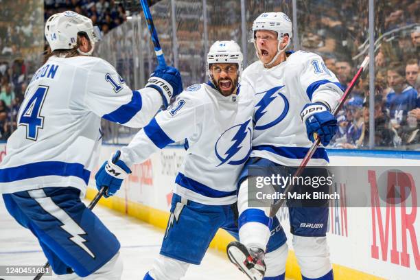 Corey Perry of the Tampa Bay Lightning celebrates his goal against the Toronto Maple Leafs with teammates Pierre-Edouard Bellemare and Pat Maroon...