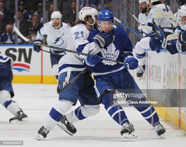 Brayden Point of the Tampa Bay Lightning grabs Mitchell Marner of the Toronto Maple Leafs by the throat during Game Two of the First Round of the...