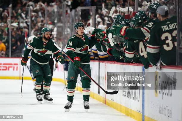 Joel Eriksson Ek of the Minnesota Wild celebrates his goal against the St. Louis Blues with teammates in the first period in Game Two of the First...