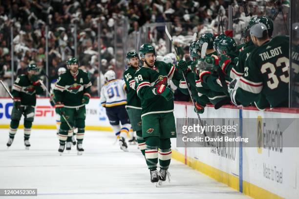 Frederick Gaudreau of the Minnesota Wild celebrates his power play goal against the St. Louis Blues with teammates in the first period in Game Two of...
