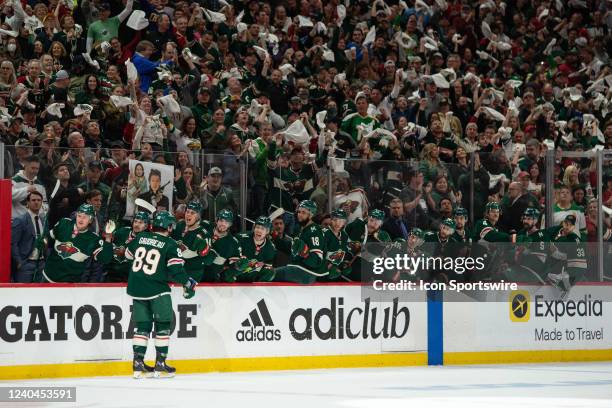 Minnesota Wild Center Frederick Gaudreau gives teammates fist bumps after a goal during game 2 of the NHL playoffs between the St. Louis Blues and...