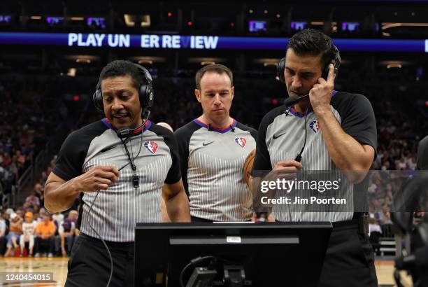 Referees Bill Kennedy, Josh Tiven and Zach Zarba review a call during the game between the Dallas Maverick and the Phoenix Suns during Game 1 of the...