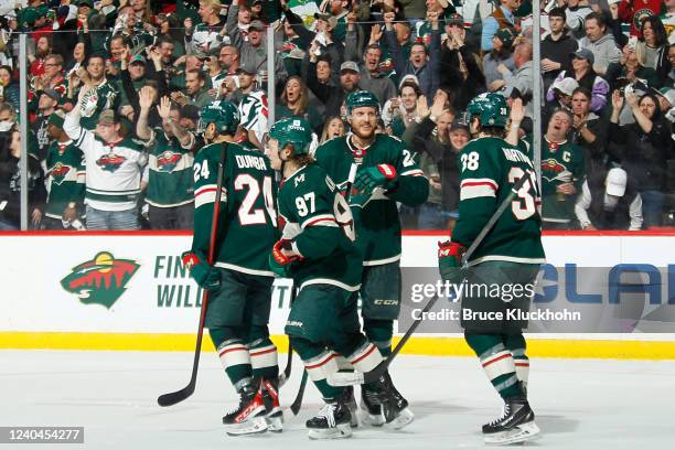 Matt Dumba, Kirill Kaprizov, Jonas Brodin and Ryan Hartman of the Minnesota Wild celebrate after scoring a goal against the St. Louis Blues in Game...