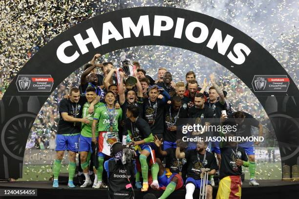 The Seattle Sounders celebrate their victory in the CONCACAF Champions League final match between Seattle Sounders and Pumas UNAM at Lumen Field in...