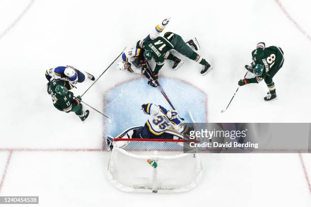 Ville Husso of the St. Louis Blues makes a save against Jordan Greenway of the Minnesota Wild in the first period in Game Two of the First Round of...