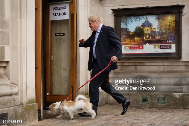 British Prime Minister and Conservative Party Leader Boris Johnson arrives to cast his vote at a polling station on May 5, 2022 in London, United...