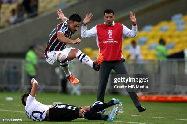 Willian Bigode of Fluminense competes for the ball with Fabian Angel of Junior Barranquilla during the match between Fluminense and Junior...
