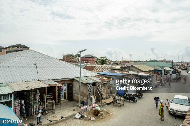 Face-Me-I-Face-You house, left, on a street in Lagos, Nigeria, on April 14, 2022. The Face-Me-I-Face-You homes found in Lagos core right to the...