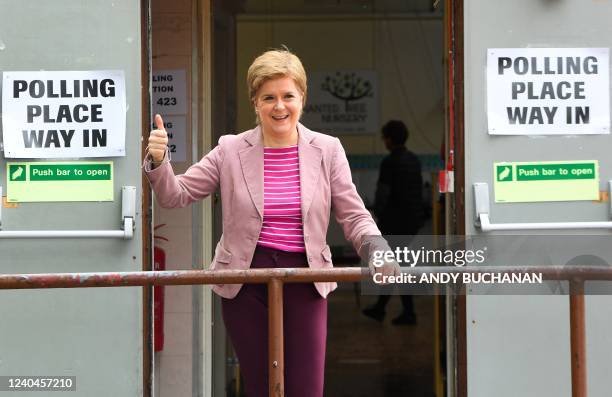 Scotland's First Minister and Scottish National Party leader Nicola Sturgeon reacts after casting her vote in local elections, at a polling station,...