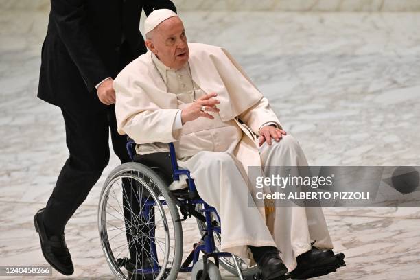 Pope Francis arrives on wheelchair during the audience to the Participants to Plenary Assembly of the International Union of Superiors General in the...