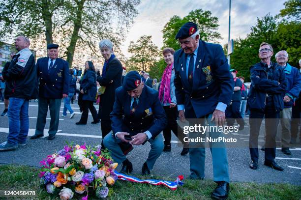 Veterans are looking to a wreath of flowers left by them before, at the &quot;Keizer Traianusplein&quot;, where two monuments in remember of the...