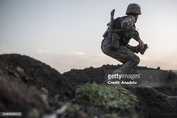 Ukrainian serviceman keeps watching the enemyâs position on the trenchesâ battlefield near to Cherkaske City, on eastern Ukraine, May 3, 2022.