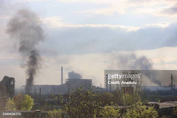 Smoke rises behind the buildings after shelling as Russian attacks continue in Mariupol, Ukraine on May 04, 2022. Residents of Mariupol at this time...
