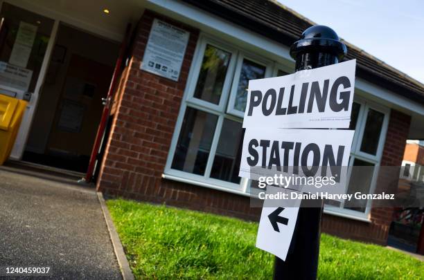 Sign indicating the location of a polling station as voters head to polling stations to cast their ballots in local elections, with council seats up...