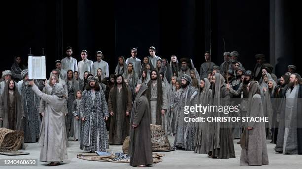 Ensemble members perform on stage during a rehearsal at Oberammergau's Passion Play theatre in Oberammergau, southern Germany on May 4, 2022. - The...