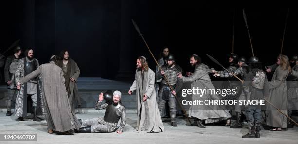 Frederik Mayet as Jesus and ensemble members perform during a rehearsal at Oberammergau's Passion Play theatre in Oberammergau, southern Germany on...