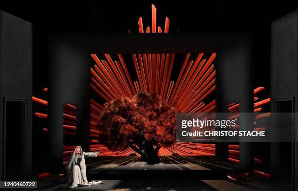 An ensemble member performs on stage during a rehearsal at Oberammergau's Passion Play theatre in Oberammergau, southern Germany on May 4, 2022. -...
