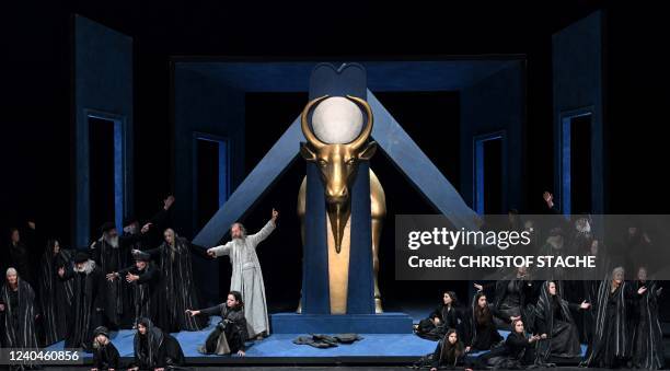 Ensemble members perform during a rehearsal at Oberammergau's Passion Play theatre in Oberammergau, southern Germany on May 4, 2022. - The...