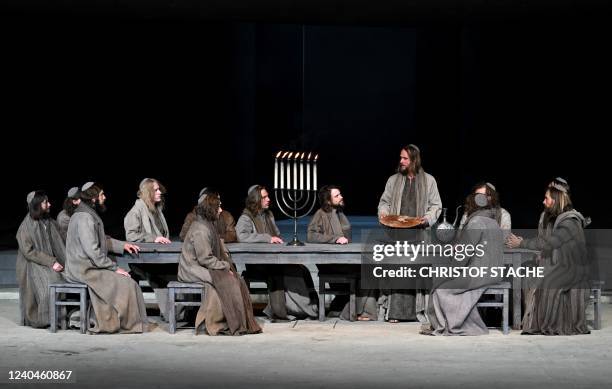 German actor Frederik Mayet as Jesus and ensemble members perform during a rehearsal at Oberammergau's Passion Play theatre in Oberammergau, southern...