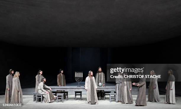 German actor Frederik Mayet as Jesus and ensemble members perform during a rehearsal at Oberammergau's Passion Play theatre in Oberammergau, southern...