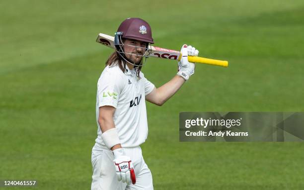 Rory Burns of Surrey acknowledges the applause on reaching his half-century during the LV= Insurance County Championship match between Surrey and...