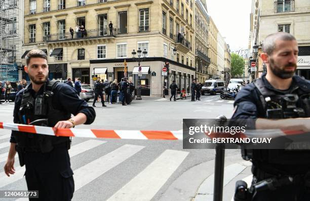 Police set up a security cordon near the entrance to a Chanel shop on Place Vendome in Paris, on May 5 after a suspected armed robbery.
