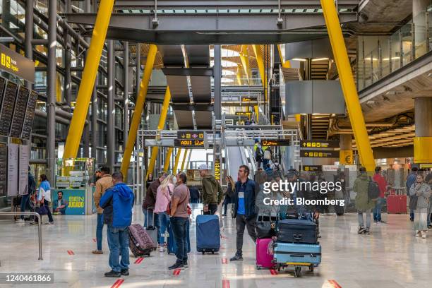 Passengers inside the departures hall at Madrid Barajas airport, operated by Aena SME SA, in Madrid, Spain, on Thursday, April 5, 2022. Europe's...