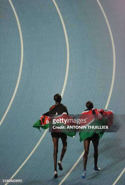 Kenya's Asbel Kiprop and Kenya's Silas Kiplagat do a lap of honour after winning gold and silver repectively in the men's 1,500 metres final at the...