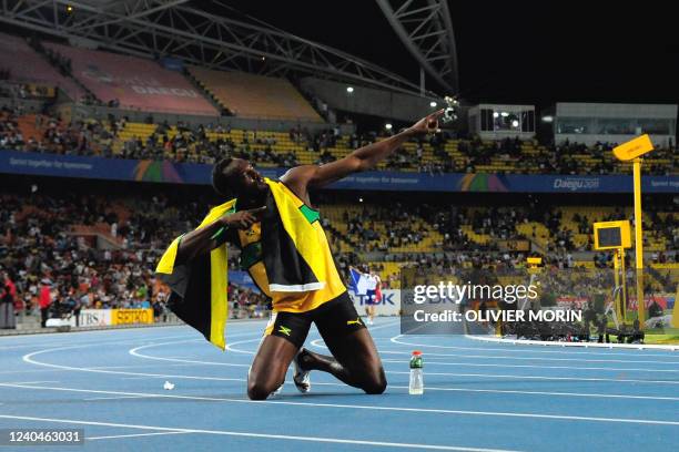 Jamaica's Usain Bolt celebrates winning gold in the men's 200 metres final at the International Association of Athletics Federations World...