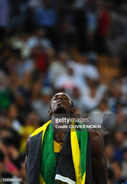 Jamaica's Usain Bolt celebrates winning gold in the men's 200 metres final at the International Association of Athletics Federations World...