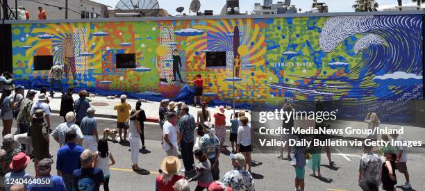 Hermosa Beach, CA The unveiling of the mural by artist John Van Hamersveld Hermosas Great Wave, on the wall of the Underground Pub & Grill, located...