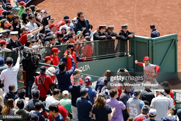 Fans gather around the bullpen as Shohei Ohtani of the Los Angeles Angels warms-up before their game against the Boston Red Sox at Fenway Park on May...