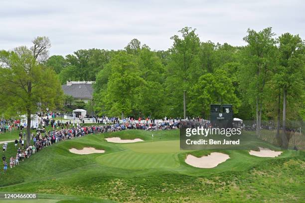 Fans surround the ninth green during the first round of the Wells Fargo Championship at TPC Potomac at Avenel Farm on May 5, 2022 in Potomac,...