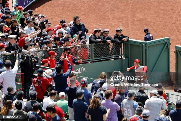 Fans gather around the bullpen as Shohei Ohtani of the Los Angeles Angels warms-up before their game against the Boston Red Sox at Fenway Park on May...