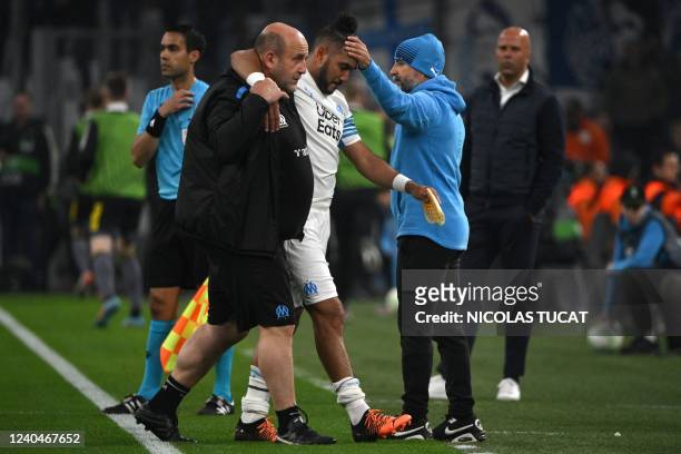 Marseille's French midfielder Dimitri Payet is greeted by Marseille's Argentinian coach Jorge Sampaoli as he leaves the pitch following an injury...
