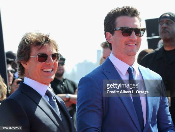 Tom Cruise and Miles Teller attend "Top Gun: Maverick" World Premiere held at The USS Midway Museum on May 4, 2022 in San Diego, California.